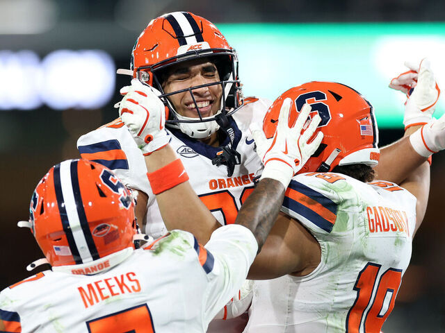SAN DIEGO, CALIFORNIA - DECEMBER 27: Jackson Meeks #7 and Darrell Gill Jr. #82 celebrate a touchdown by Oronde Gadsden II #19 of the Syracuse Orange during the first half of the DirecTV Holiday Bowl against the Washington State Cougars at Snapdragon Stadium on December 27, 2024 in San Diego, California.