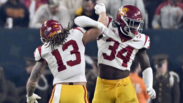 LAS VEGAS, NEVADA - DECEMBER 27: Mason Cobb #13 and Braylan Shelby #34 of the USC Trojans react after a play against the Texas A&M Aggies during first half of the SRS Distribution Las Vegas Bowl at Allegiant Stadium on December 27, 2024 in Las Vegas, Nevada.
