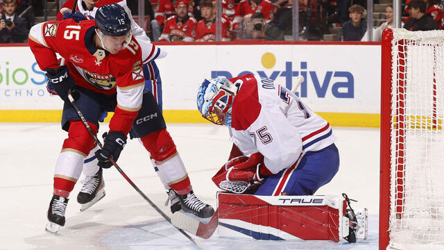 SUNRISE, FLORIDA - DECEMBER 28: Goaltender Jakub Dobes #75 of the Montreal Canadianscdefends the net against Anton Lundell #15 of the Florida Panthers at the Amerant Bank Arena on December 28, 2024 in Sunrise, Florida.