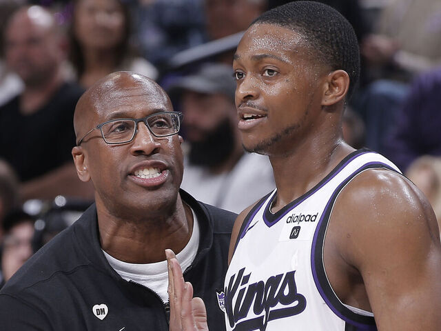 SACRAMENTO, CA - APRIL 16: Head Coach Mike Brown of the Sacramento Kings coaches De'Aaron Fox #5 and Keon Ellis #23 during the game against the Golden State Warriors during the 2024 Play-In Tournament on April 16, 2024 at Golden 1 Center in Sacramento, California. NOTE TO USER: User expressly acknowledges and agrees that, by downloading and or using this photograph, User is consenting to the terms and conditions of the Getty Images Agreement. Mandatory Copyright Notice: Copyright 2024 NBAE