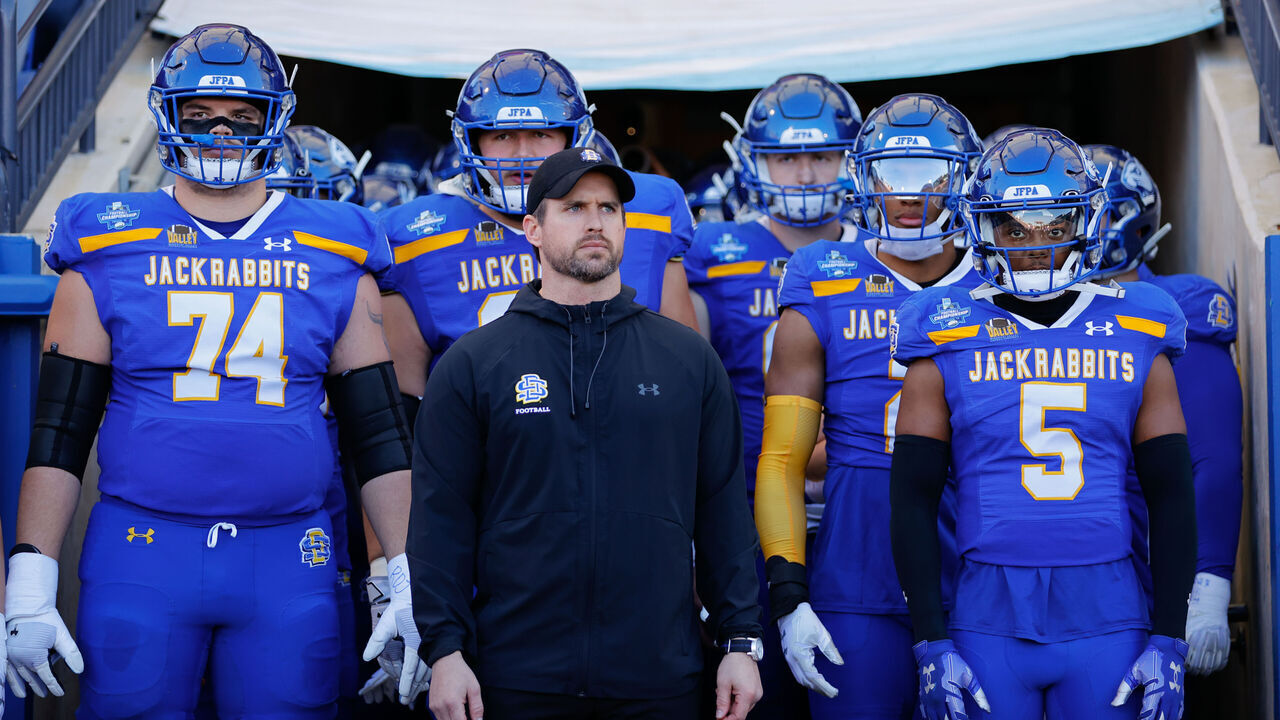 FRISCO, TEXAS - JANUARY 7: Head coach Jimmy Rogers of the South Dakota State Jackrabbits looks on with his team before taking the field against the Montana Grizzlies during the Division I FCS Football Championship held at Toyota Stadium on January 7, 2024 in Frisco, Texas.
