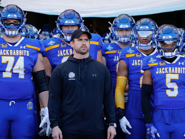 FRISCO, TEXAS - JANUARY 7: Head coach Jimmy Rogers of the South Dakota State Jackrabbits looks on with his team before taking the field against the Montana Grizzlies during the Division I FCS Football Championship held at Toyota Stadium on January 7, 2024 in Frisco, Texas.