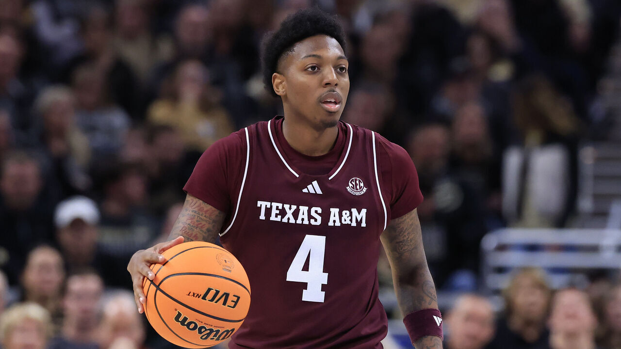 INDIANAPOLIS, INDIANA - DECEMBER 14: Wade Taylor IV #4 of the Texas A&M Aggies brings the ball up the court against the Purdue Boilermakers during the second half at Mackey Arena on December 14, 2024 in West Lafayette, Indiana.