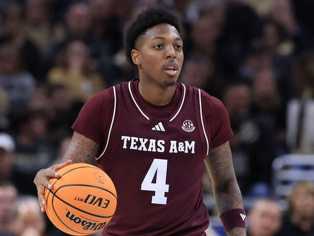 INDIANAPOLIS, INDIANA - DECEMBER 14: Wade Taylor IV #4 of the Texas A&M Aggies brings the ball up the court against the Purdue Boilermakers during the second half at Mackey Arena on December 14, 2024 in West Lafayette, Indiana.