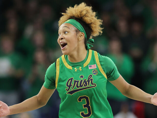 SOUTH BEND, INDIANA - DECEMBER 12: Hannah Hidalgo #3 of the Notre Dame Fighting Irish celebrates a three pointer by Liatu King #20 (not pictured) against the UConn Huskies during the first half at Purcell Pavilion at the Joyce Center on December 12, 2024 in South Bend, Indiana.