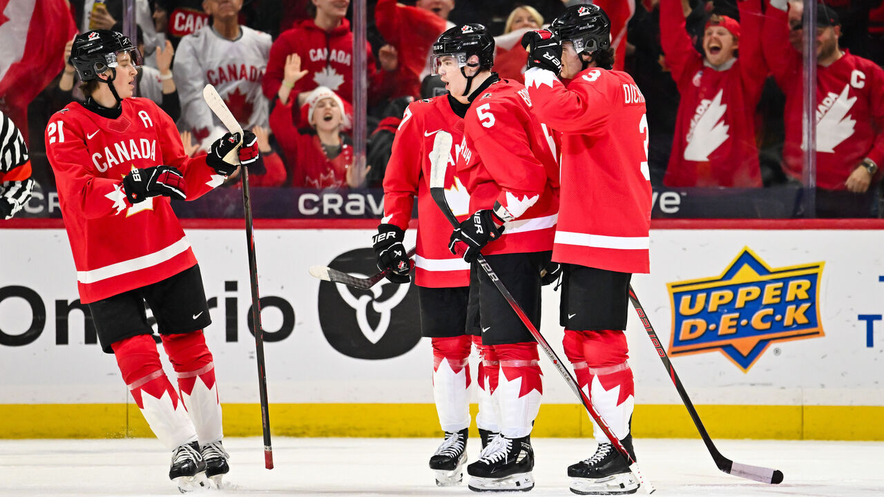 OTTAWA, CANADA - DECEMBER 29: Oliver Bonk #5 of Team Canada celebrates his goal with teammates Sam Dickinson #3 and Calum Ritchie #21 in the first period against Team Germany of the Group A match during the 2025 IIHF World Junior Championship at Canadian Tire Centre on December 29, 2024 in Ottawa, Ontario, Canada.