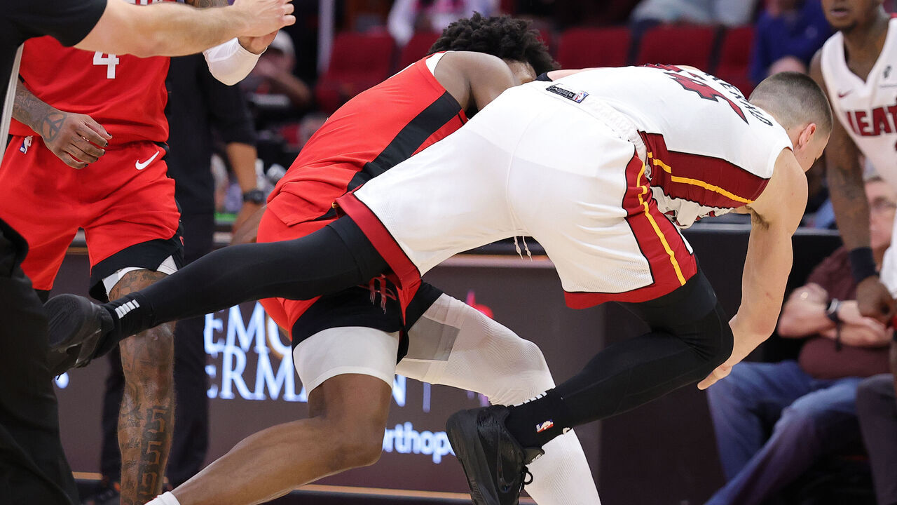 HOUSTON, TEXAS - DECEMBER 29: Tyler Herro #14 of the Miami Heat is thrown to the floor by Amen Thompson #1 of the Houston Rockets during an altercation on the court during the second half at Toyota Center on December 29, 2024 in Houston, Texas.