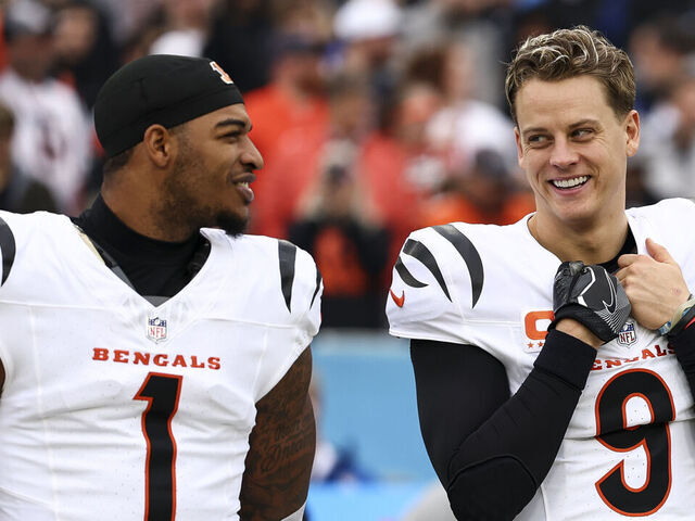NASHVILLE, TENNESSEE - DECEMBER 15: Joe Burrow #9 of the Cincinnati Bengals smiles with Ja'Marr Chase #1 prior to an NFL football game against the Tennessee Titans at Nissan Stadium on December 15, 2024 in Nashville, Tennessee.