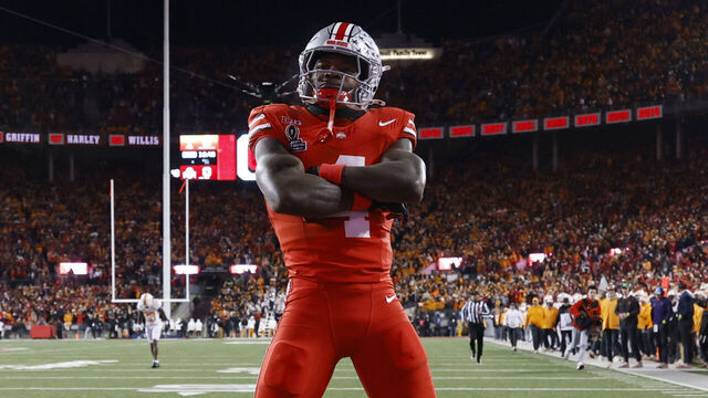 COLUMBUS, OH - DECEMBER 21: Ohio State Buckeyes wide receiver Jeremiah Smith (4) reacts after a 37-yard touchdown reception in the first quarter against the Tennessee Volunteers during the CFP First Round game on December 21, 2024 at Ohio Stadium in Columbus, Ohio.