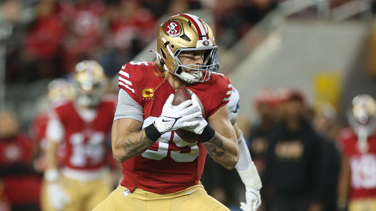 SANTA CLARA, CALIFORNIA - DECEMBER 30: George Kittle #85 of the San Francisco 49ers carries the ball after his reception against the Detroit Lions during the first quarter at Levi's Stadium on December 30, 2024 in Santa Clara, California.