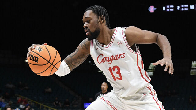 LAS VEGAS, NEVADA - NOVEMBER 30: J'Wan Roberts #13 of the Houston Cougars dribbles the ball against the San Diego State Aztecs in the first half of their game during the Players Era Festival basketball tournament at MGM Grand Garden Arena on November 30, 2024 in Las Vegas, Nevada. The Aztecs defeated the Cougars 73-70 in overtime.