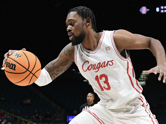 LAS VEGAS, NEVADA - NOVEMBER 30: J'Wan Roberts #13 of the Houston Cougars dribbles the ball against the San Diego State Aztecs in the first half of their game during the Players Era Festival basketball tournament at MGM Grand Garden Arena on November 30, 2024 in Las Vegas, Nevada. The Aztecs defeated the Cougars 73-70 in overtime.
