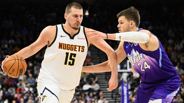 SALT LAKE CITY, UTAH - DECEMBER 30: Nikola Jokic #15 of the Denver Nuggets drives into Walker Kessler #24 of the Utah Jazz during the second half of a game at Delta Center on December 30, 2024 in Salt Lake City, Utah.