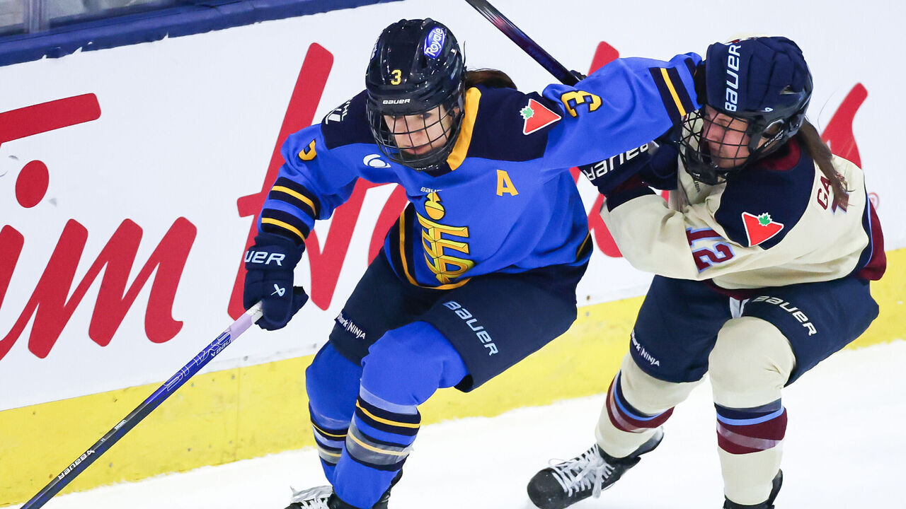 TORONTO, CANADA - DECEMBER 21: Jocelyne Larocque #3 of Toronto Sceptres skates with the puck against Jennifer Gardiner #12 of Montréal Victoire at Coca-Cola Coliseum on December 21, 2024 in Toronto, Ontario, Canada.