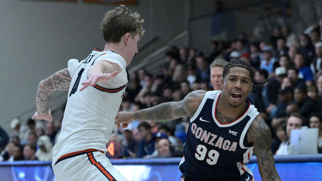MALIBU, CALIFORNIA - DECEMBER 30: Khalif Battle #99 of the Gonzaga Bulldogs drives past Jaxon Olvera #10 of the Pepperdine Waves in the second half at Firestone Fieldhouse on December 30, 2024 in Malibu, California.