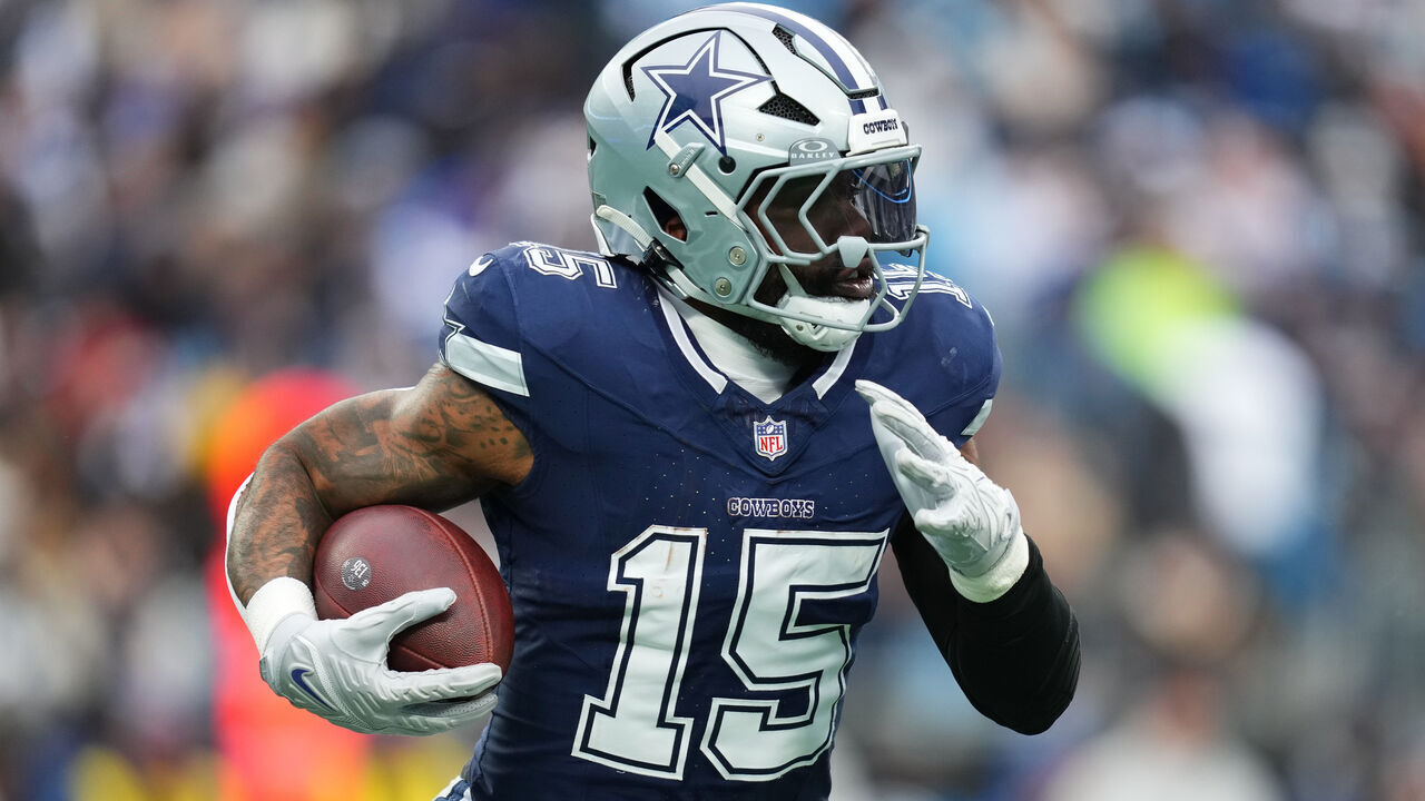 CHARLOTTE, NORTH CAROLINA - DECEMBER 15: Ezekiel Elliott #15 of the Dallas Cowboys carries the ball against the Carolina Panthers during the third quarter at Bank of America Stadium on December 15, 2024 in Charlotte, North Carolina.