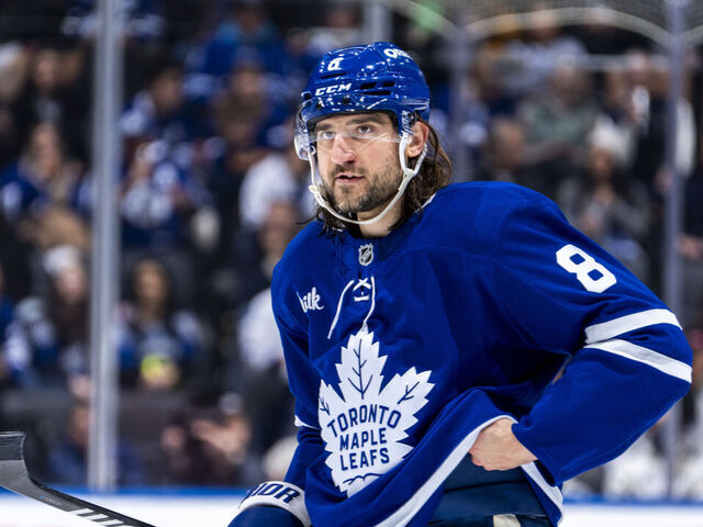 TORONTO, ON - DECEMBER 21: Chris Tanev #8 of the Toronto Maple Leafs looks on against the New York Islanders at the Scotiabank Arena on December 21, 2024 in Toronto, Ontario, Canada.