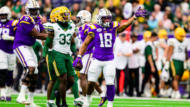 HOUSTON, TEXAS - DECEMBER 31: Josh Williams #18 of the LSU Tigers runs the ball during the first half of the Kinder's Texas Bowl against the Baylor Bears at NRG Stadium on December 31, 2024 in Houston, Texas.