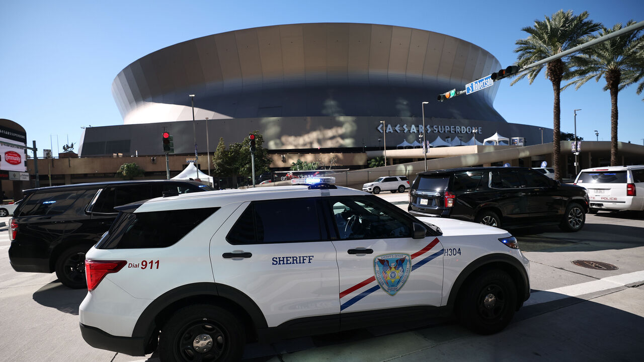 NEW ORLEANS, LOUISIANA - JANUARY 01: Police vehicles are seen outside the Louisiana Superdome after at least ten people were killed on Bourbon Street when a person allegedly drove into a crowd in the early morning hours of New Year's Day on January 1, 2025 in New Orleans, Louisiana. Dozens more were injured after a suspect in a rented pickup truck allegedly drove around barricades and through a crowd of New Year's revelers on Bourbon Street. The suspect then got out of the car, opened fire on police officers, and was subsequently killed by law enforcement.