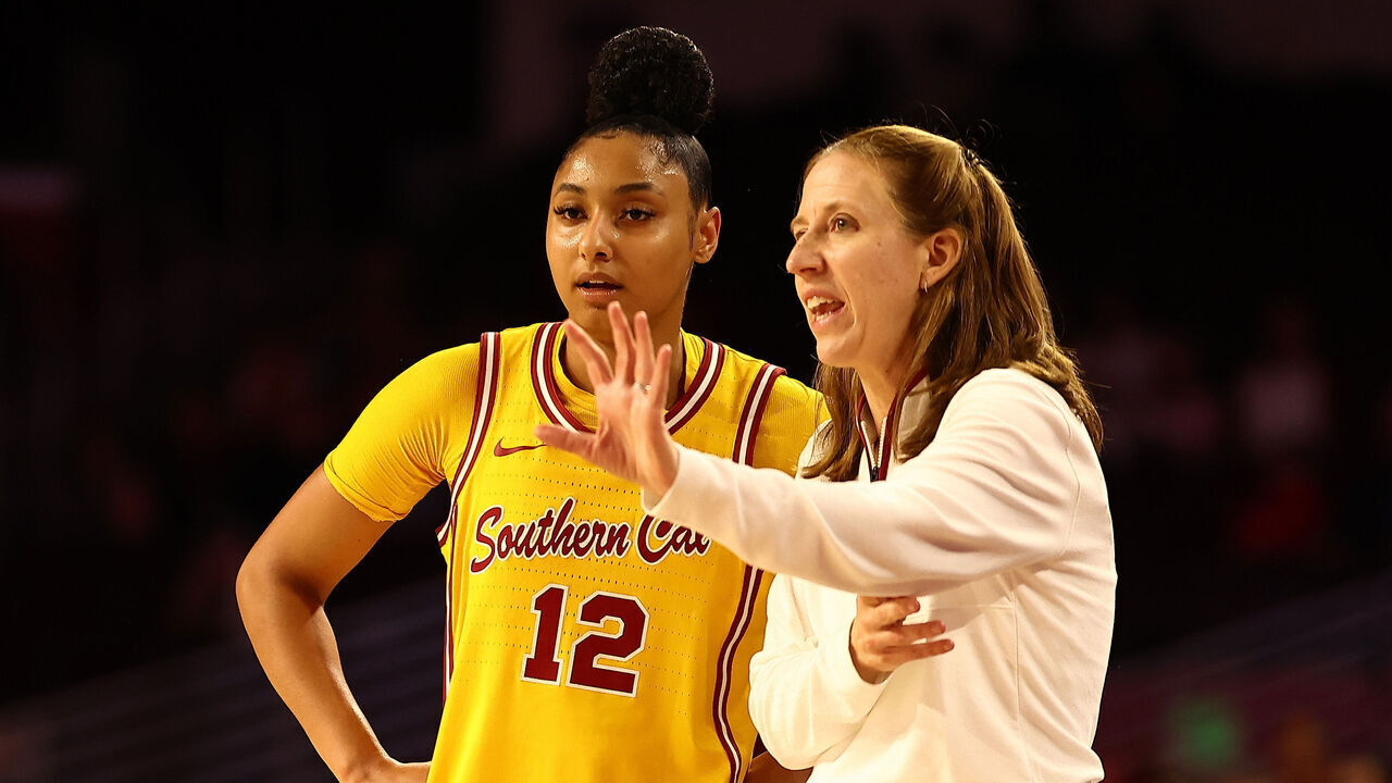 LOS ANGELES, CALIFORNIA - JANUARY 01: JuJu Watkins #12 of the USC Trojans talks to head coach Lindsay Gottlieb during the second quarter of the game against the Nebraska Huskers at Galen Center on January 01, 2025 in Los Angeles, California.