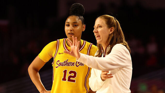 LOS ANGELES, CALIFORNIA - JANUARY 01: JuJu Watkins #12 of the USC Trojans talks to head coach Lindsay Gottlieb during the second quarter of the game against the Nebraska Huskers at Galen Center on January 01, 2025 in Los Angeles, California.