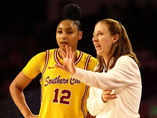 LOS ANGELES, CALIFORNIA - JANUARY 01: JuJu Watkins #12 of the USC Trojans talks to head coach Lindsay Gottlieb during the second quarter of the game against the Nebraska Huskers at Galen Center on January 01, 2025 in Los Angeles, California.