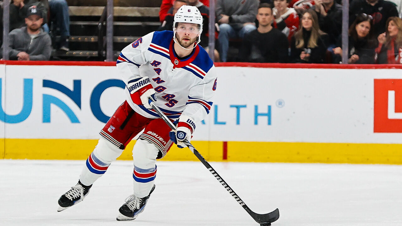 RALEIGH, NC - NOVEMBER 27: Zac Jones #6 of the New York Rangers skates with the puck during the first period of the game against the Carolina Hurricanes at Lenovo Center on November 27, 2024 in Raleigh, North Carolina.