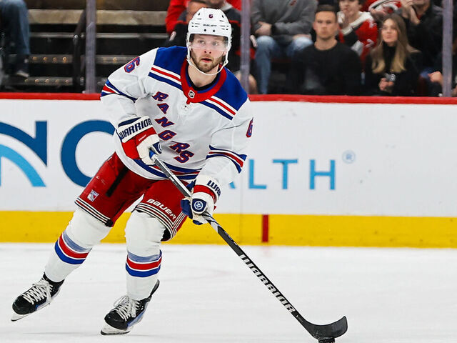 RALEIGH, NC - NOVEMBER 27: Zac Jones #6 of the New York Rangers skates with the puck during the first period of the game against the Carolina Hurricanes at Lenovo Center on November 27, 2024 in Raleigh, North Carolina.