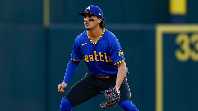 SEATTLE, WASHINGTON - AUGUST 11: Josh Rojas #4 of the Seattle Mariners in defensive position at third base in the ninth inning during a game against the New York Mets at T-Mobile Park on August 11, 2024 in Seattle, Washington.