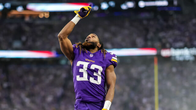MINNEAPOLIS, MINNESOTA - DECEMBER 29: Aaron Jones #33 of the Minnesota Vikings looks on during a game between the Minnesota Vikings and Green Bay Packers at U.S. Bank Stadium on December 29, 2024 in Minneapolis, Minnesota.