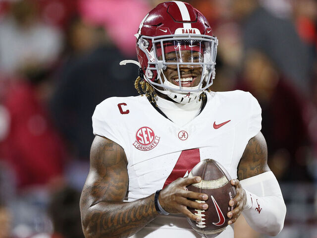 NORMAN, OKLAHOMA - NOVEMBER 23: Quarterback Jalen Milroe #4 of the Alabama Crimson Tide smiles before a game against the Oklahoma Sooners at Gaylord Family Oklahoma Memorial Stadium on November 23, 2024 in Norman, Oklahoma.
