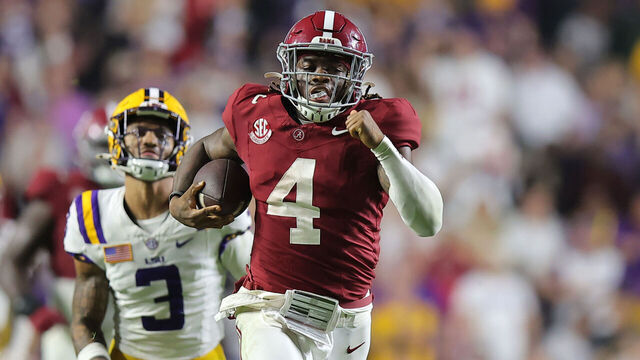 BATON ROUGE, LOUISIANA - NOVEMBER 09: Jalen Milroe #4 of the Alabama Crimson Tide rushes for a touchdown as Sage Ryan #3 of the LSU Tigers defends during the second half at Tiger Stadium on November 09, 2024 in Baton Rouge, Louisiana.