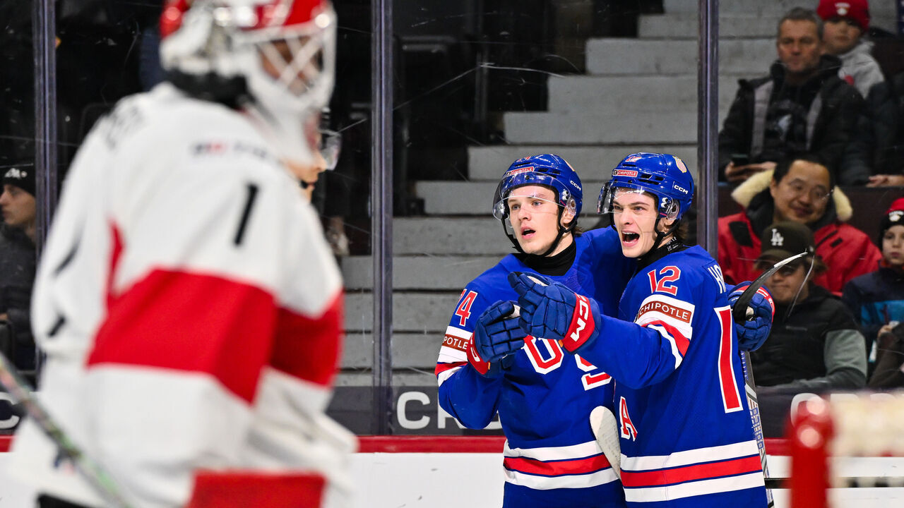 OTTAWA, CANADA - JANUARY 02: James Hagens #12 of Team USA celebrates his goal with teammate Cole Hutson #24 in the first period against Team Switzerland of the quarterfinals match during the 2025 IIHF World Junior Championship at Canadian Tire Centre on January 2, 2025 in Ottawa, Ontario, Canada.