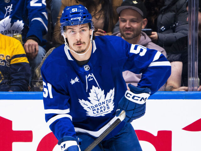 TORONTO, ON - DECEMBER 15: Philippe Myers #51 of the Toronto Maple Leafs skates Buffalo Sabres during the first period at the Scotiabank Arena on December 15, 2024 in Toronto, Ontario, Canada.