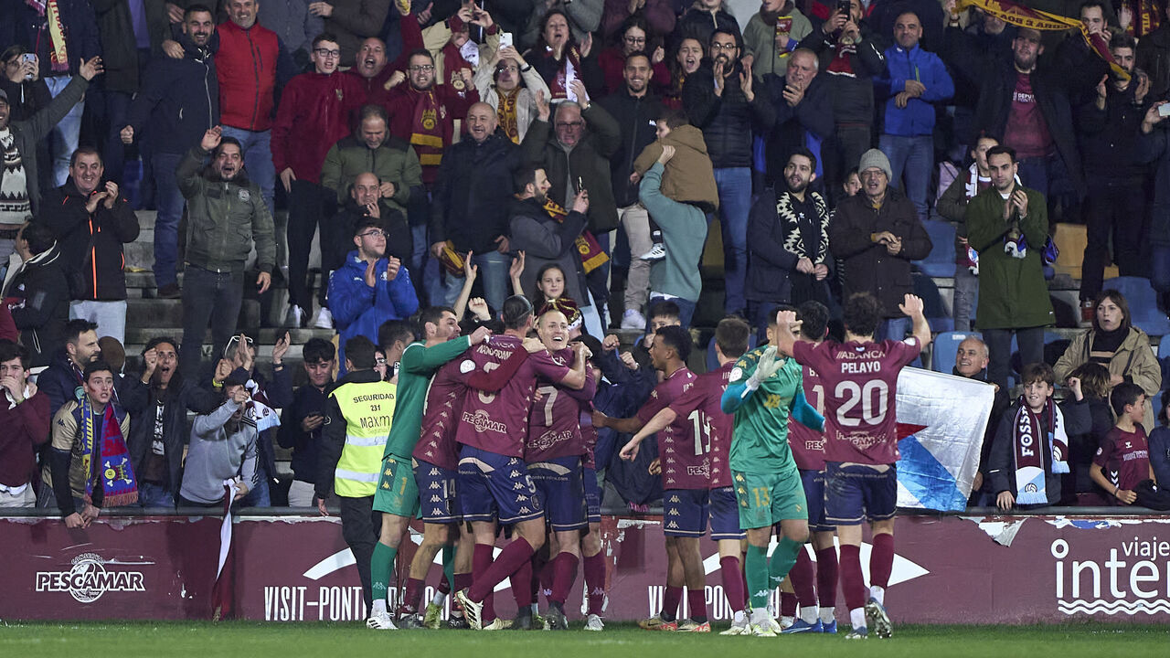 Rufo Sanchez of Pontevedra CF celebrates with his teammates after scoring his team's third goal during the Copa del Rey Round of 32 match between Pontevedra CF and RCD Mallorca at Estadio De Pasaron in Pontevedra, Spain, on January 3, 2025.