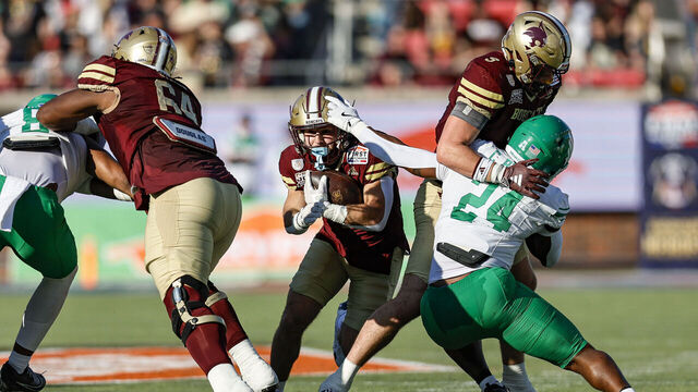 DALLAS, TX - JANUARY 03: Texas State Bobcats running back Lincoln Pare (7) gets tackled by North Texas Mean Green linebacker Chavez Brown (24) during the SERVPRO First Responders bowl game between the Texas State Bobcats and the North Texas Mean Green on January 3, 2025 at Gerald J. Ford Stadium in Dallas, Texas.