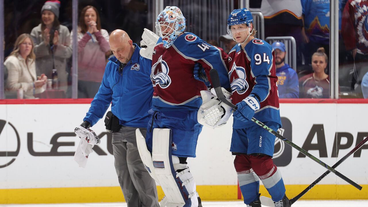 DENVER, COLORADO - JANUARY 02: Colorado Avalanche head athletictrainer Matt Sokolowski (left) and Joel Kiviranta #94 (right) help Goaltender Scott Wedgewood #41 off the ice during the third period against the Buffalo Sabres at Ball Arena on January 2, 2025 in Denver, Colorado.