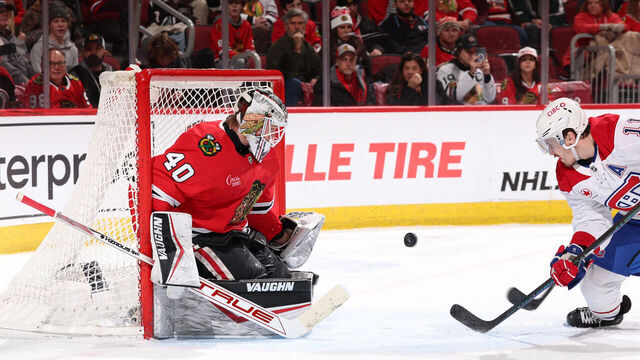 CHICAGO, ILLINOIS - JANUARY 03: Goalie Arvid Soderblom #40 of the Chicago Blackhawks gets in position to stop the puck as Brendan Gallagher #11 of the Montreal Canadiens watches from in front, in the third period, at the United Center on January 03, 2025 in Chicago, Illinois.