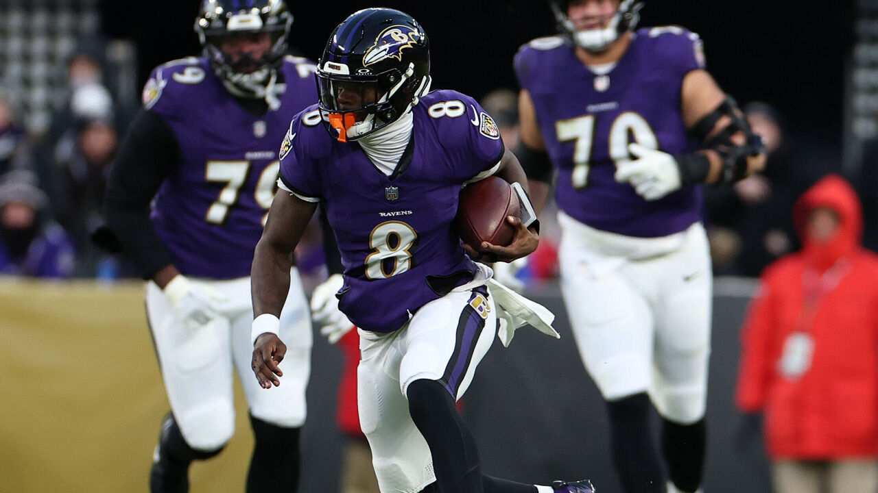BALTIMORE, MARYLAND - JANUARY 04: Lamar Jackson #8 of the Baltimore Ravens runs with the ball during the first quarter against the Cleveland Browns at M&T Bank Stadium on January 04, 2025 in Baltimore, Maryland.