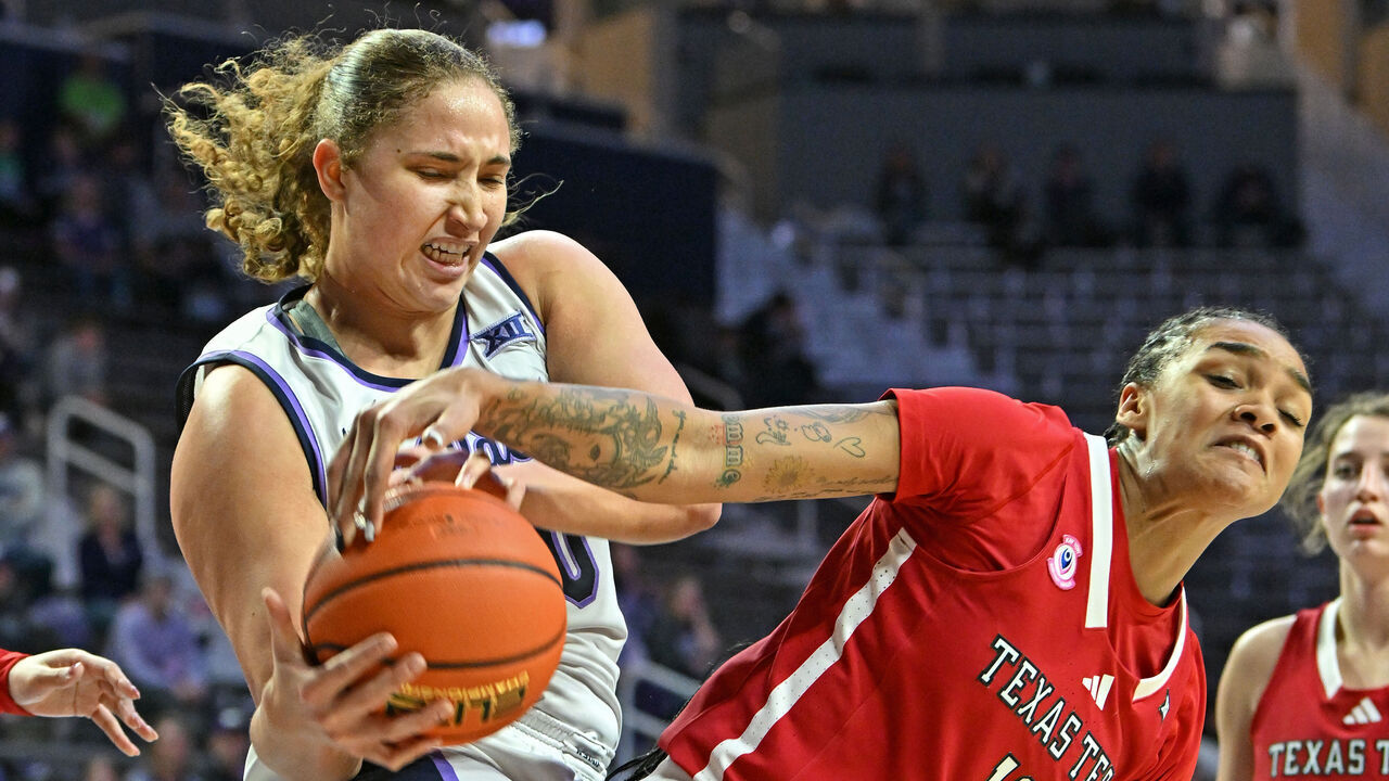 MANHATTAN, KS - JANUARY 04: Ayoka Lee #50 of the Kansas State Wildcats battles for the ball with Jordyn Merritt #12 of the Texas Tech Red Raiders in the second half at Bramlage Coliseum on January 4, 2025 in Manhattan, Kansas.