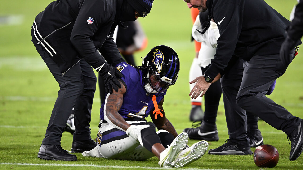 BALTIMORE, MARYLAND - JANUARY 04: Zay Flowers #4 of the Baltimore Ravens lays on the field after an apparent injury during the second quarter against the Cleveland Browns at M&T Bank Stadium on January 04, 2025 in Baltimore, Maryland.