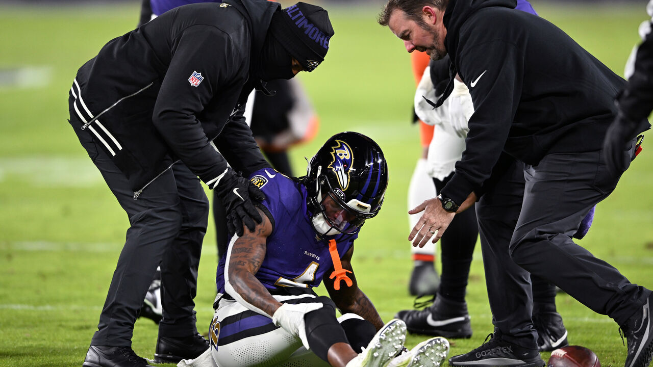 BALTIMORE, MARYLAND - JANUARY 04: Zay Flowers #4 of the Baltimore Ravens lays on the field after an apparent injury during the second quarter against the Cleveland Browns at M&T Bank Stadium on January 04, 2025 in Baltimore, Maryland.