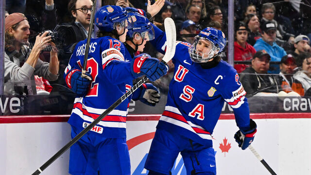 OTTAWA, CANADA - JANUARY 04: Gabe Perreault #34 of Team USA celebrates his goal with teammates James Hagens #12 and Ryan Leonard #9 in the first period against Team Czechia of the semifinal match during the 2025 IIHF World Junior Championship at Canadian Tire Centre on January 4, 2025 in Ottawa, Ontario, Canada.