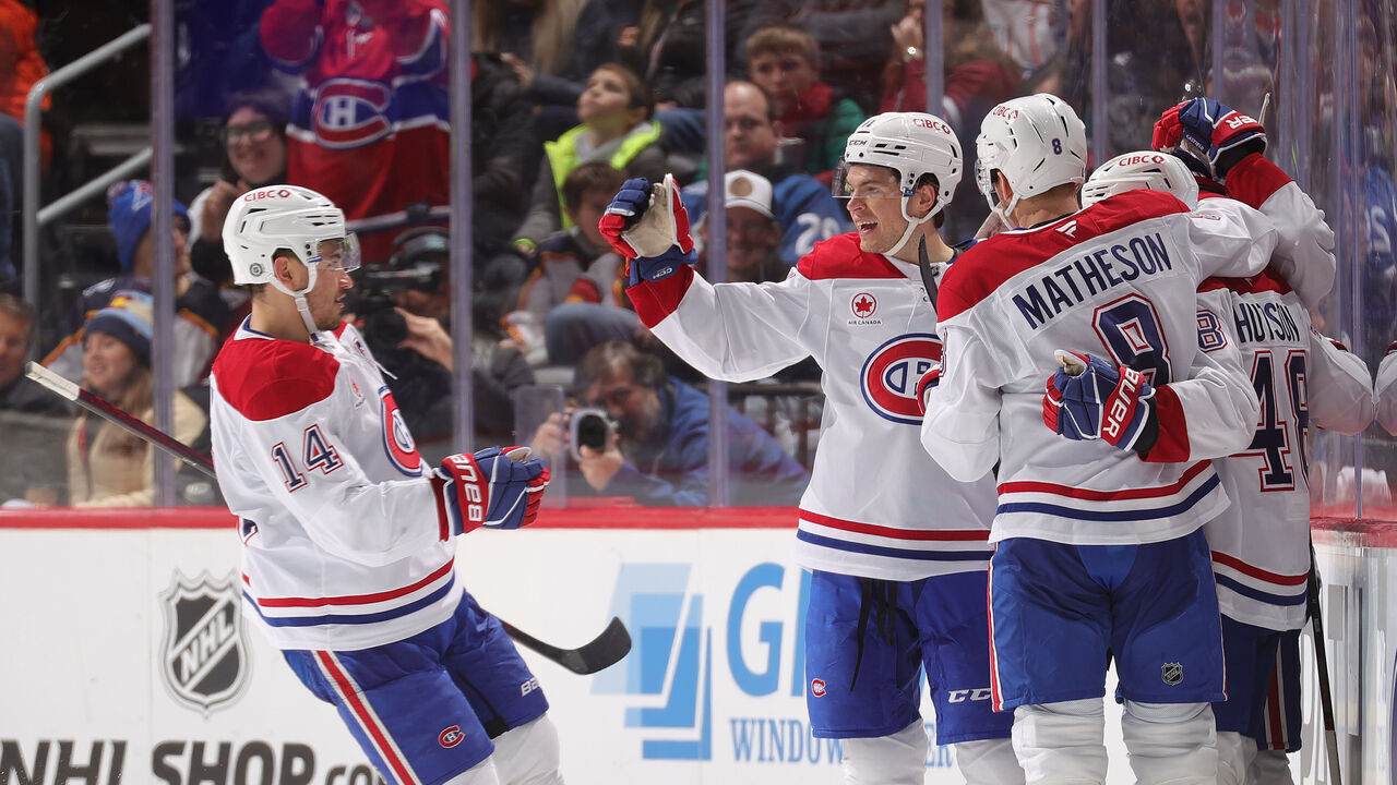 DENVER, COLORADO - JANUARY 04: Nick Suzuki #14, Jake Evans #71, Mike Matheson #8, Lane Hutson #48 and Cole Caufield #13 of the Montreal Canadiens celebrate a goal against the Colorado Avalanche at Ball Arena on January 4, 2025 in Denver, Colorado.