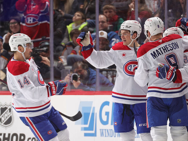 DENVER, COLORADO - JANUARY 04: Nick Suzuki #14, Jake Evans #71, Mike Matheson #8, Lane Hutson #48 and Cole Caufield #13 of the Montreal Canadiens celebrate a goal against the Colorado Avalanche at Ball Arena on January 4, 2025 in Denver, Colorado.