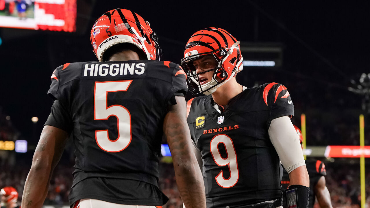 CINCINNATI, OHIO - DECEMBER 28: Tee Higgins #5 and Joe Burrow #9 of the Cincinnati Bengals celebrate after scoring a touchdown in the fourth quarter against the Denver Broncos at Paycor Stadium on December 28, 2024 in Cincinnati, Ohio.