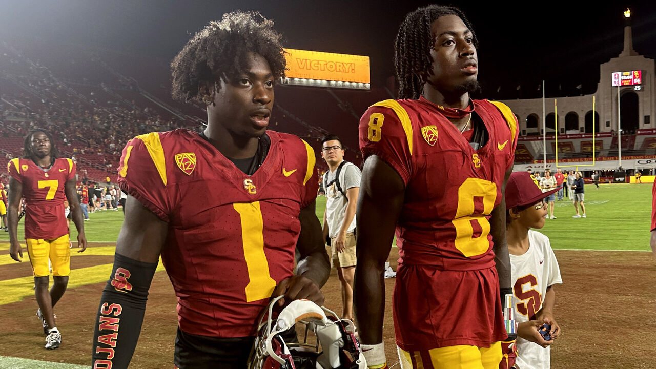 Los Angeles, - September 09: Wide receiver Zachariah Branch #1 and safety Zion Branch #8 of the USC Trojans walk off the field after defeating the Stanford Cardinal 56-10 during a NCAA football game at the Los Angeles Memorial Coliseum in Los Angeles on Saturday, September 9, 2023.