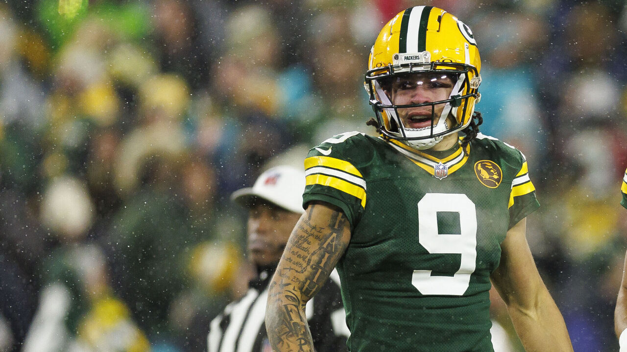 GREEN BAY, WISCONSIN - NOVEMBER 28: Wide receiver Christian Watson #9 of the Green Bay Packers and quarterback Jordan Love #10 stands on the field during an NFL football game against the Miami Dolphins, at Lambeau Field on November 28, 2024 in Green Bay, Wisconsin.