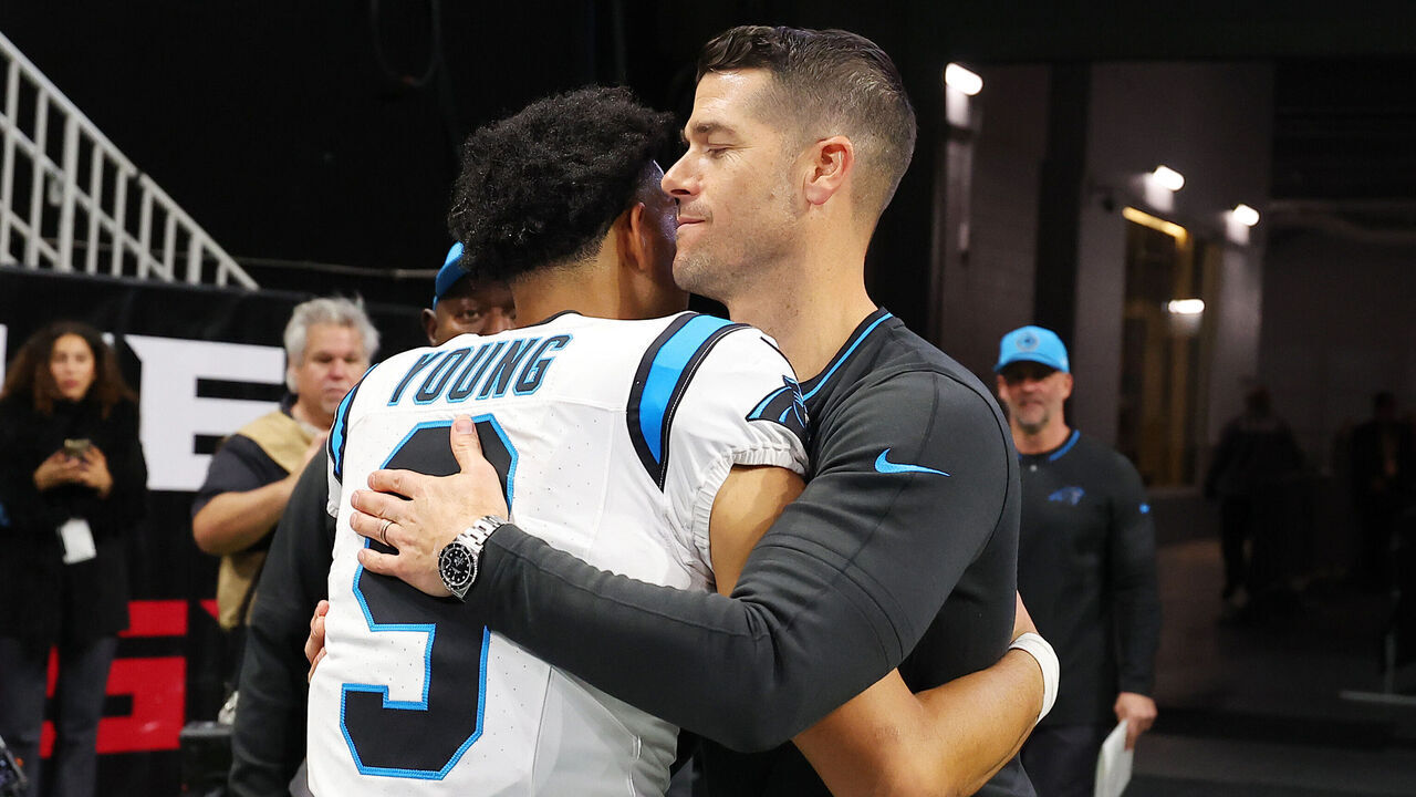 ATLANTA, GEORGIA - JANUARY 05: Bryce Young #9 of the Carolina Panthers hugs head coach Dave Canales of the Carolina Panthers after the game against the Atlanta Falcons at Mercedes-Benz Stadium on January 05, 2025 in Atlanta, Georgia.