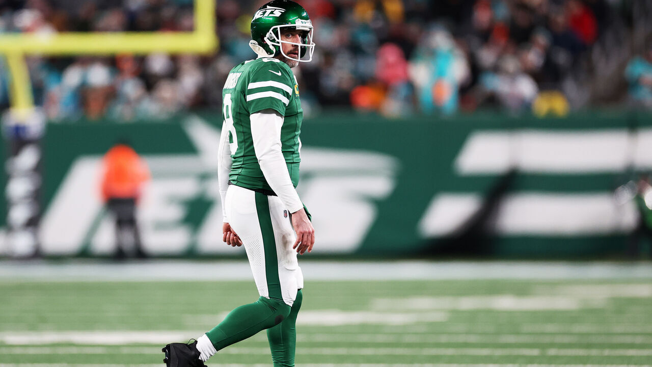 EAST RUTHERFORD, NEW JERSEY - JANUARY 05: Aaron Rodgers #8 of the New York Jets walks off the field after an incompletion during the third quarter against the Miami Dolphins at MetLife Stadium on January 05, 2025 in East Rutherford, New Jersey.